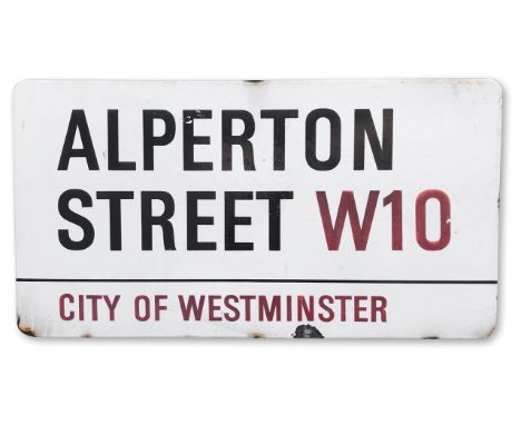 An enamelled iron street sign for Alperton Street W10, City of Westminster, with iconic and black and red sans serif letterin