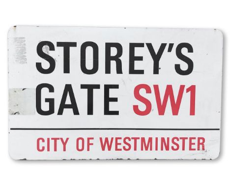 An enamelled iron street sign for Storey's Gate SW1, City of Westminster, with iconic and black and red sans serif lettering 