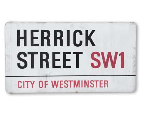An enamelled iron street sign for Herrick Street SW1, City of Westminster, with iconic and black and red sans serif lettering