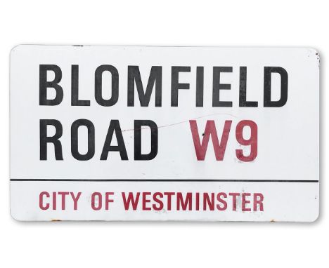 An enamelled iron street sign for Blomfield Road W9, City of Westminster, with iconic and black and red sans serif lettering 