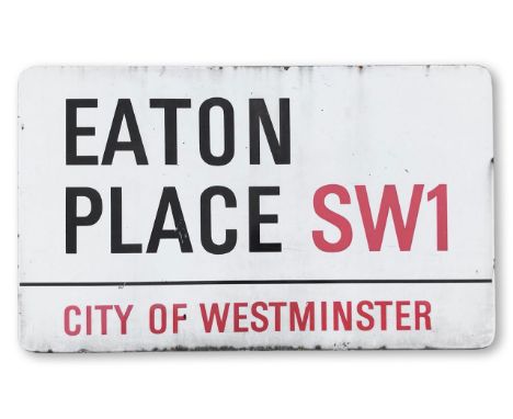 An enamelled iron street sign for Eaton Place SW1, City of Westminster, with iconic and black and red sans serif lettering fi