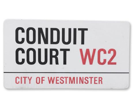An enamelled iron street sign for Conduit Court WC2, City of Westminster, on wooden frame to back, with iconic black and red 