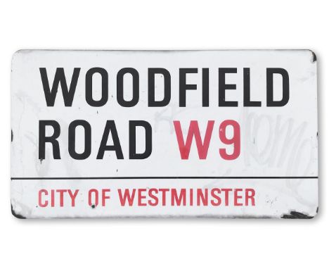 An enamelled iron street sign for Woodfield Road W9, City of Westminster, with iconic and black and red sans serif lettering 