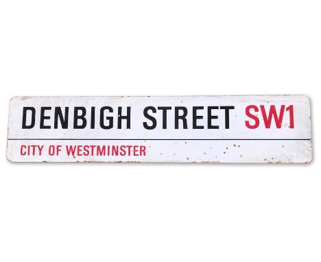 An enamelled iron street sign for Denbigh Street SW1, City of Westminster, with iconic and black and red sans serif lettering
