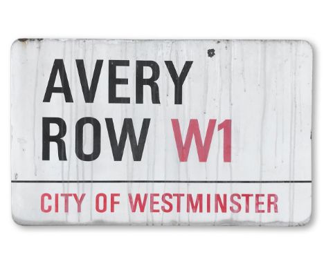 An enamelled iron street sign for Avery Row W1, City of Westminster, with iconic and black and red sans serif lettering first