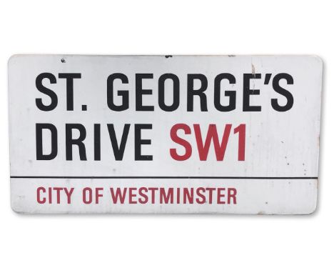 An enamelled iron street sign for St George's Drive SW1, City of Westminster, with iconic and black and red sans serif letter