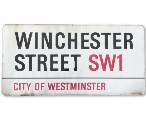An enamelled iron street sign for Winchester Street SW1, City of Westminster, with iconic and black and red sans serif letter