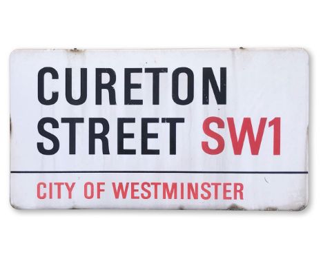 An enamelled iron street sign for Cureton Street SW1, City of Westminster, part wooden frame to back, with iconic black and r