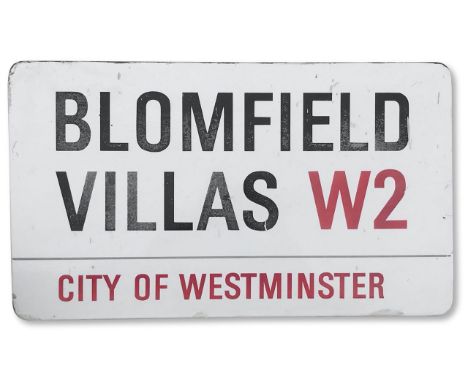 An enamelled iron street sign for Blomfield Villas SW1, City of Westminster, with iconic and black and red sans serif letteri