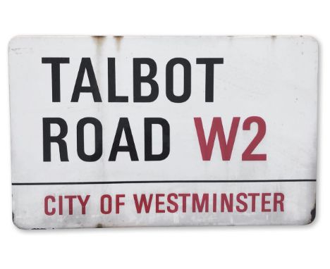 An enamelled iron street sign for Talbot Road W2, City of Westminster, with iconic and black and red sans serif lettering fir