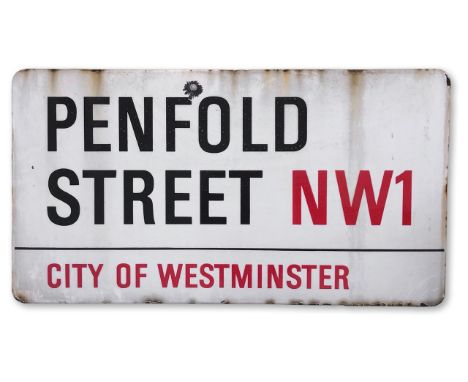 An enamelled iron street sign for Penfold Street NW1, City of Westminster, on wooden frame to back, with iconic and black and