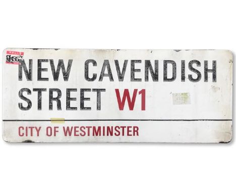 An enamelled iron street sign for New Cavendish Street W1, City of Westminster, with iconic and black and red sans serif lett