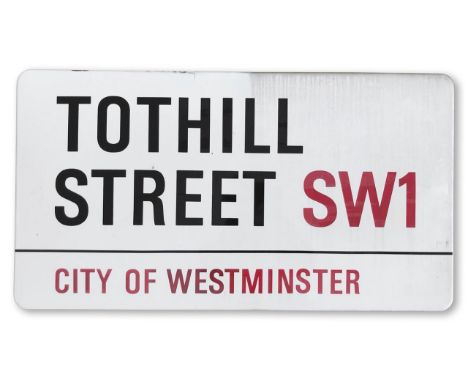 An enamelled iron street sign for Tothill Street SW1, City of Westminster, with iconic and black and red sans serif lettering