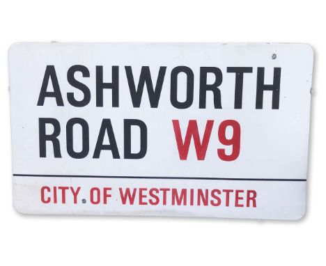 An enamelled iron street sign for Ashworth Road W9, City of Westminster, on wooden frame to back, with iconic and black and r