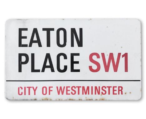 An enamelled iron street sign for Eaton Place SW1 City of Westminster, with iconic and black and red sans serif lettering fir