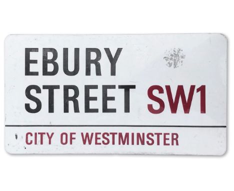 An enamelled iron street sign for Ebury Street SW1, City of Westminster with iconic black and red sans serif lettering first 
