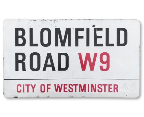 An enamelled iron street sign for Blomfield Road W9, City of Westminster, with iconic and black and red sans serif lettering 