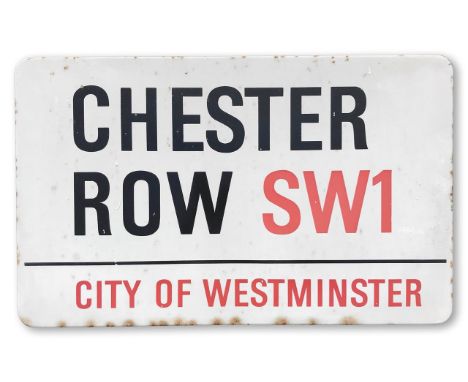 An enamelled iron street sign for Chester Row SW1, City of Westminster, with iconic and black and red sans serif lettering fi
