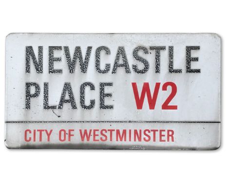 An enamelled iron street sign for Newcastle Place W2, City of Westminster with iconic black and red sans serif lettering firs