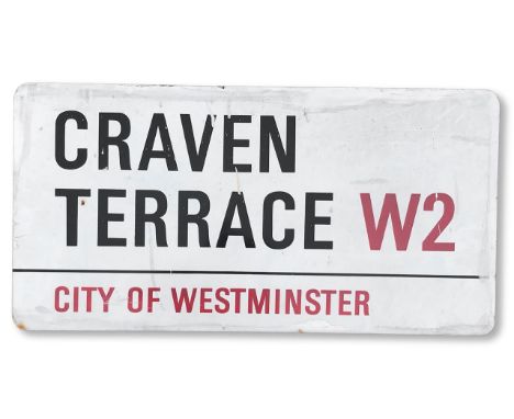 An enamelled iron street sign for Craven Terrace W2, City of Westminster, with iconic and black and red sans serif lettering 