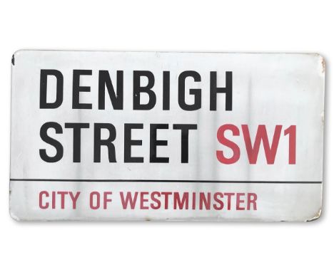 An enamelled iron street sign for Denbigh Street, SW1 City of Westminster, with iconic and black and red sans serif lettering