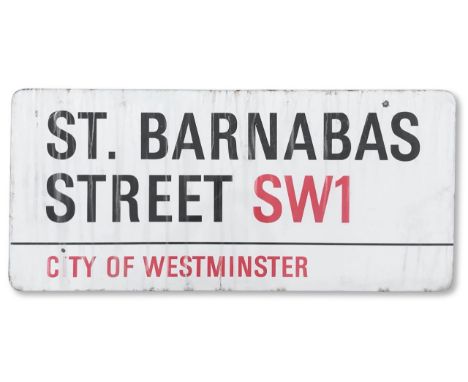 An enamelled iron street sign for St. Barnabas Street SW1, City of Westminster, with iconic and black and red sans serif lett