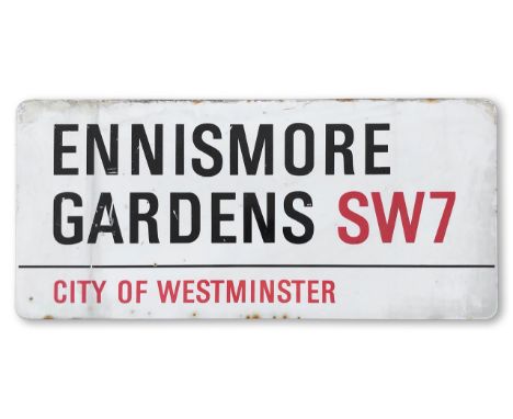 An enamelled iron street sign for Ennismore Gardens SW7, City of Westminster, with iconic and black and red sans serif letter