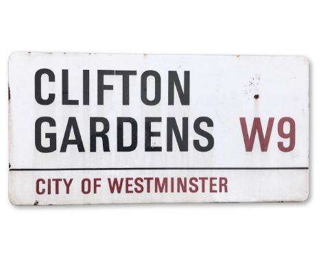 An enamelled iron street sign for Clifton Gardens W9, City of Westminster, with iconic black and red sans serif lettering fir