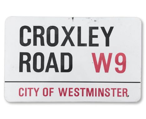 An enamelled iron street sign for Croxley Road W9, City of Westminster, with iconic and black and red sans serif lettering fi