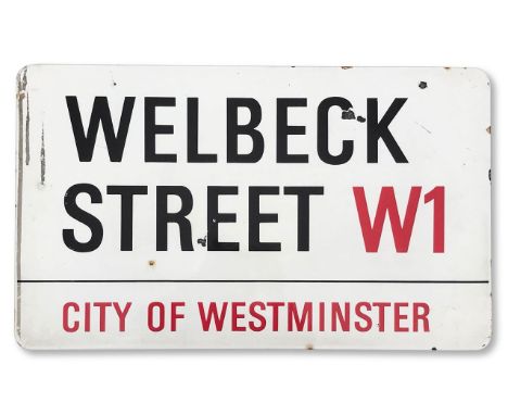 An enamelled iron street sign for Wellbeck Street W1, City of Westminster, with iconic and black and red sans serif lettering