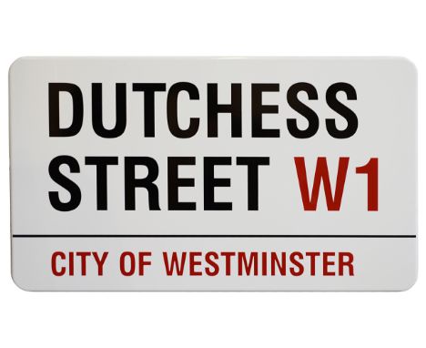 An enamelled iron street sign for Dutchess Street W1, City of Westminster, with iconic and black and red sans serif lettering