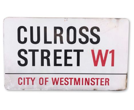 An enamelled iron street sign for Culross Street W1, City of Westminster, on wooden frame to back, with iconic black and red 