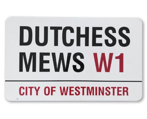 An enamelled iron street sign for Dutchess Mews W1, City of Westminster, with iconic and black and red sans serif lettering f