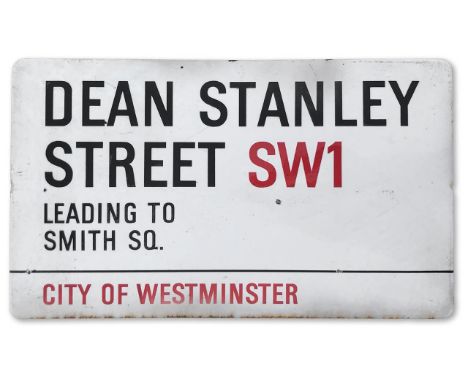 An enamelled iron street sign for Dean Stanley Street SW1 Leading to Smith Sq., City of Westminster with iconic black and red