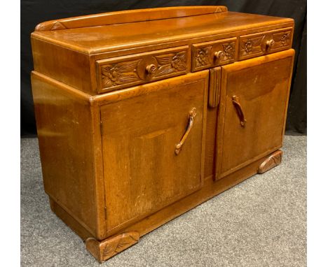 A 1940’s Art Deco style oak sideboard, 92cm high x 136.5cm wide x 49.5cm deep. 