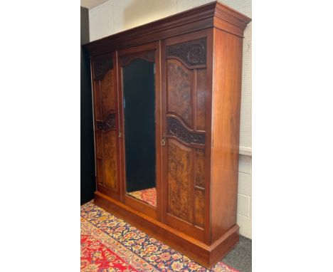 A Victorian mahogany and burr walnut compactum  wardrobe, architectural pediment, central full length mirrored door, serpenti