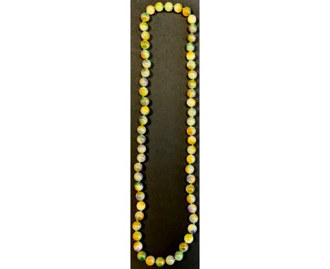 A globular green beaded necklace, possibly jade 