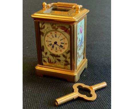 A modern miniature porcelain and gilt metal carriage clock, key wind movement, 6cm high, 3.5cm wide 