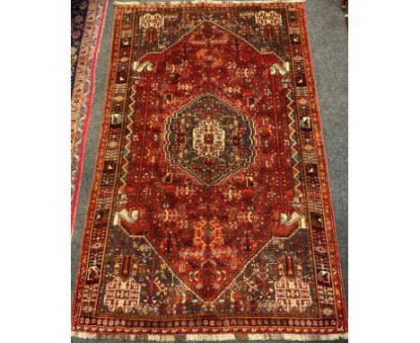 A South-West Persian Qashgai rug / carpet, hand-knotted with a hexagonal medallion with an intricate field of stylised motifs