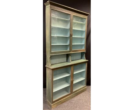 A late Victorian painted mahogany shop display / bookcase cabinet, architectural pediment, glazed doors to top and base, four