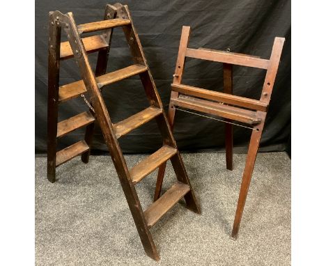 An early Victorian pine step ladder, 121cm high x 37cm wide, c.1860;  a 19th century stained pine easel stand, 100cm high x 5