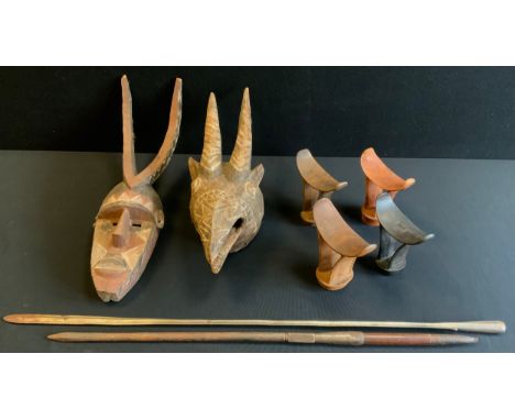 Tribal Art - four Somali head rests each geometrically hand carved, typically with interlaced strapwork; a East African hunti