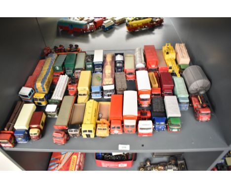 A shelf of Corgi and similar die-casts, Wagons, Tractor Units, Articulated Wagons etc