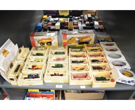 A shelf of modern die-casts, Joal Compact C225 Hydraulic Excavator and 773B Dumper Truck, both boxed and 30 Lledo including R