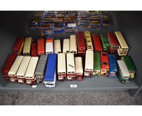 A shelf of Corgi and similar playworn die-casts, all Buses