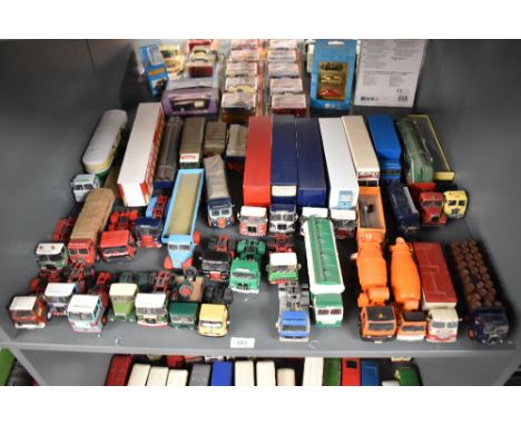 A shelf of Corgi and similar playworn die-casts Wagons, Articulated Truck and Tractor Units