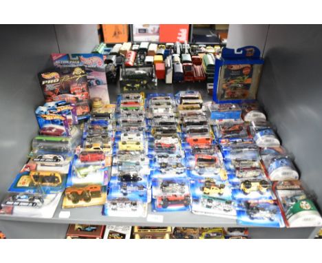 A shelf of 1990's, 2000's Mattel Hot Wheels die-casts, 65 in total all on bubble cards