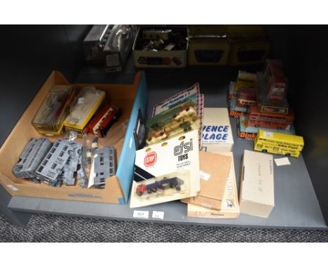 A shelf of metal bus kits, die-cast buses including Dinky, Majorette and Efsi Wagons etc