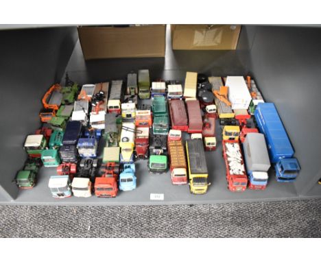 A shelf of Corgi and similar die-casts, Wagons, Tractor Units, Articulated Wagons etc