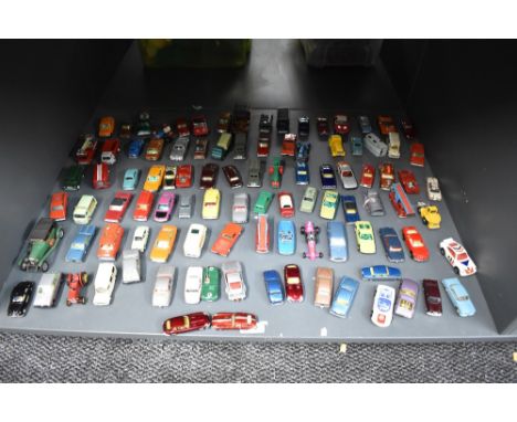 A shelf of playuworn die-casts, Matchbox, Husky, Guisval etc, most in good condition with little sign of wear, 90+